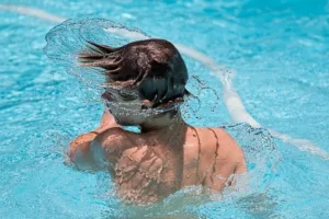 Boy trapped in swimming pool skimmer
