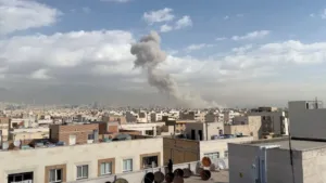 Iran says branch of country’s oldest bank was bombed, warns of retribution