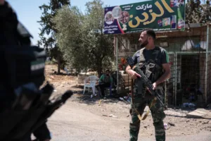 Syria bolsters Lebanon border with troops and rocket units, sources say
