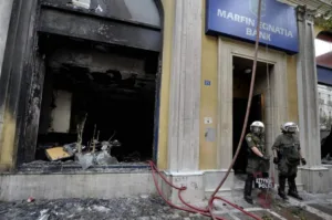 Greek police arrest two over 2010 Athens bank arson that killed three workers