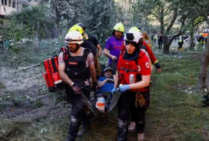 Russian overnight attack on Kyiv kills at least eight and injures 34, officials say