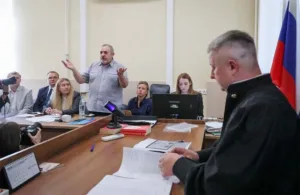 Russia detains blogger and fines anti-war politician ahead of September election