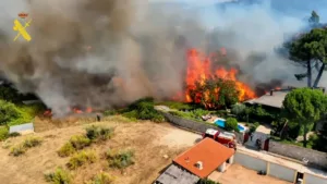 Mass evacuations as wildfires spread in France and Spain