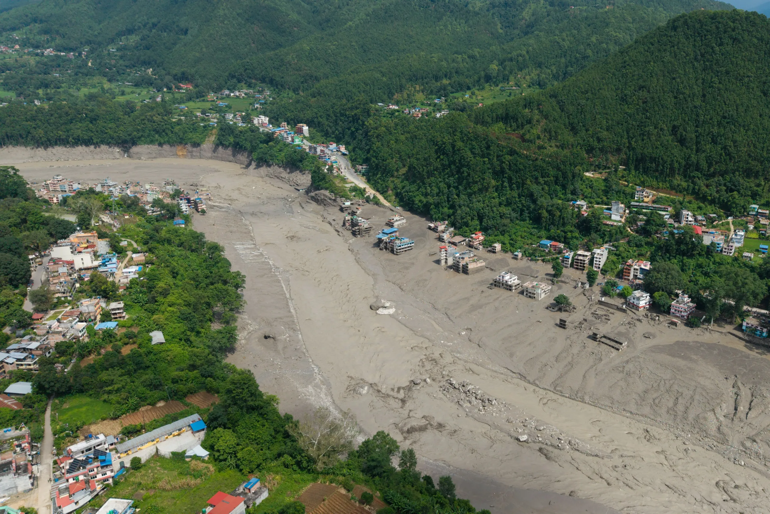 Nepal-Tibet border mudslide kills scores as hundreds of tourists remain missing