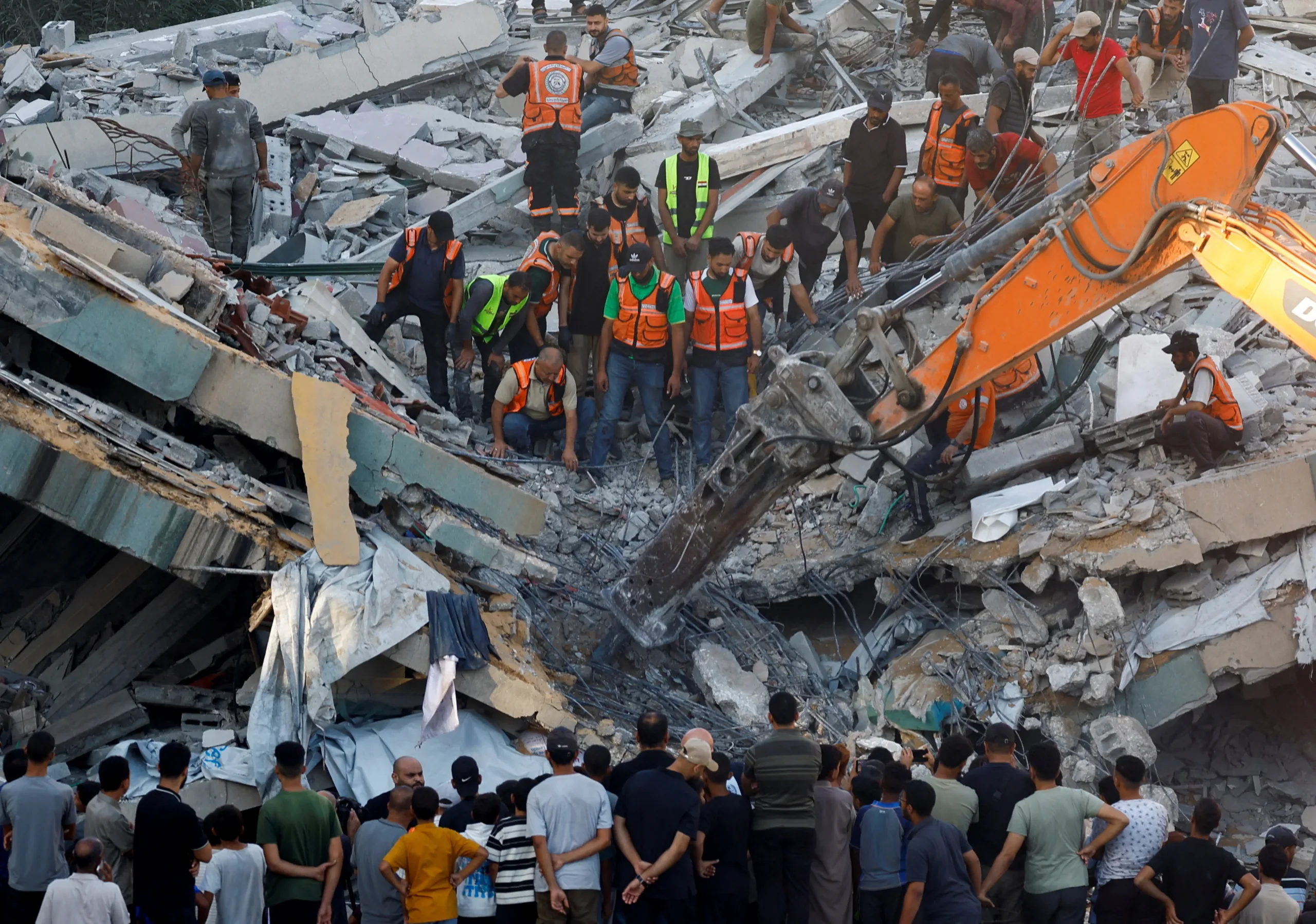 Gaza building collapse kills 12 Palestinians as rescuers search for survivors