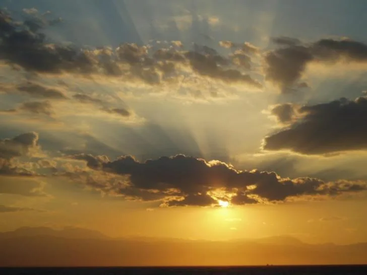 Mostly clear weather forecast with isolated mountain rain possible