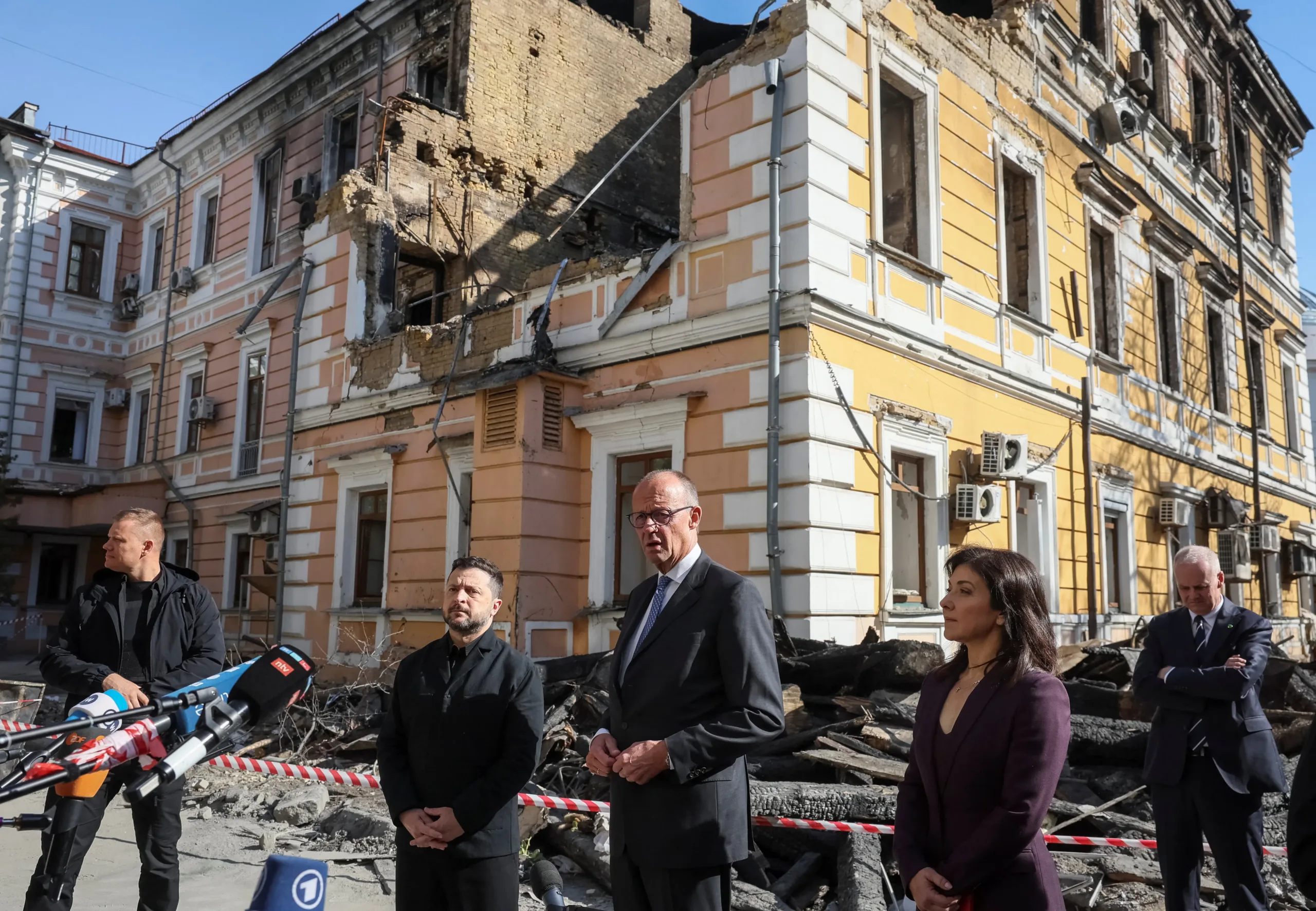 Merz pledges support for Ukraine as air raid sirens and explosions sound in Kyiv